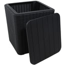 Black, faux rattan side table with inside storage with lid off resting on the side.