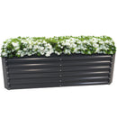 Long, rectangular gray metal garden with white flowers.