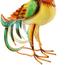 Orange feet of colorful metal rooster statues.