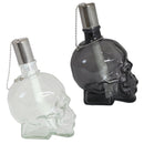 Profile of one white and one black clear skull torches with metal snuffer caps.