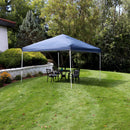 Blue 12'x12' pop up canopy with white frame set up on a green lawn.