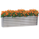 Rectangular silver metal garden with orange flowers.