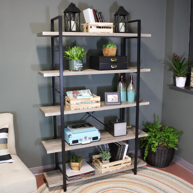 Oak gray living room 5 tier bookshelf holding multiple decor items.
