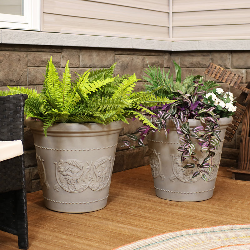 Large garden planter pots offering protection to its flowers on the deck.
