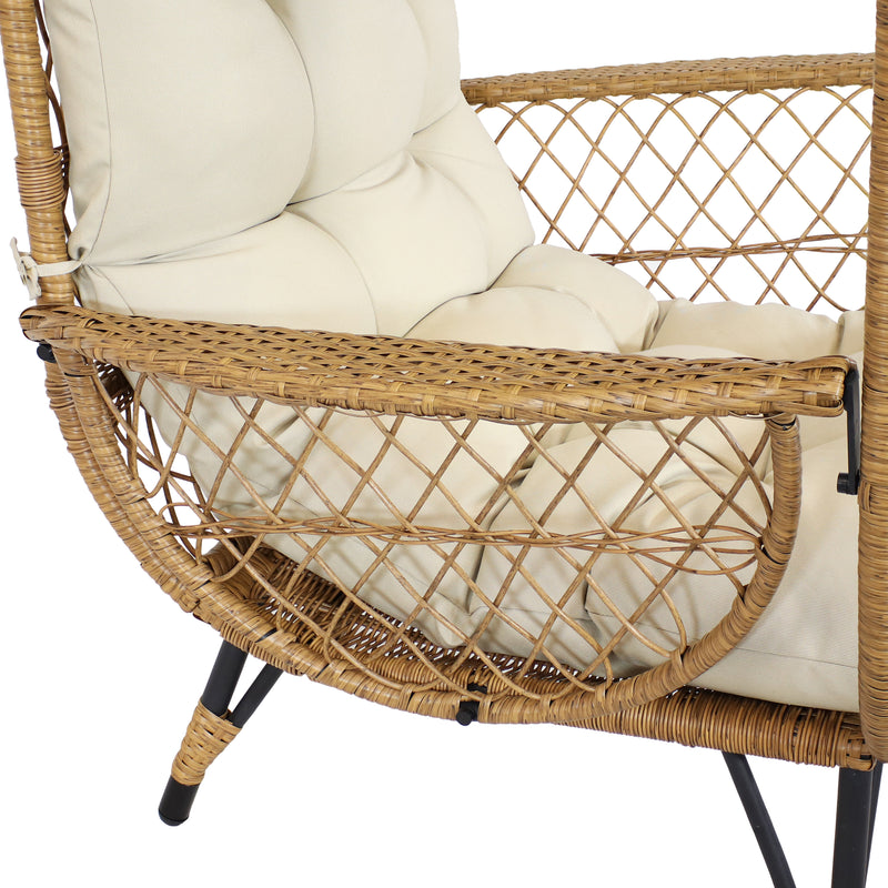 Light brown wicker armrest of comfort wicker egg chair.