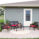 Outdoor sectional chaise sofa set with red-colored cushions and gray accent throw pillow sitting outside on a concrete patio
