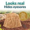 Infographic featuring a tall, tapered tan faux rock cover with a realistic stone texture in a mulched garden bed. Text reads “Looks real, Hides eyesores” with a callout explaining how it blends unsightly utilities into the landscape. Three metal ground stakes are displayed beside the rock.