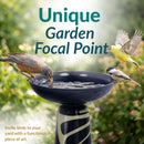 Infographic showing a navy blue and cream pedestal bird bath with three birds gathered around it, highlighting its unique garden focal point and decorative, functional design.