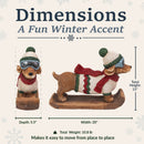 Dimensions infographic featuring a winter dachshund statue, showing a height of 15 inches, width of 20 inches, depth of 5.5 inches, and weight of 10.8 pounds.