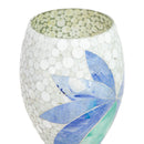 Close-up of the Mosaic Bloom Glass Bird Bath in indigo, showing the open top of the pedestal with a light circular mosaic pattern and blue, indigo, and aqua floral accents.