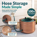 Copper Hammered Iron Hose Pot shown storing a coiled garden hose, featuring a 100-foot hose capacity, 2-inch side opening for easy spigot connection, and three drainage holes to help reduce water buildup.