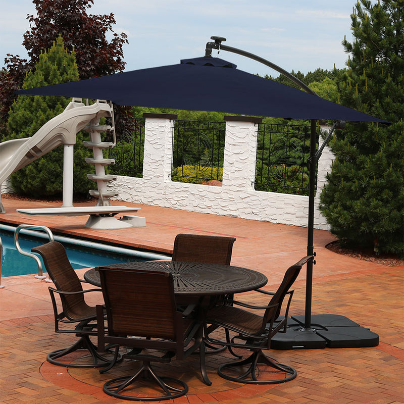 Sunnydaze 10-Foot Offset Cantilever Solar Patio Umbrella with Outdoor LED Lights, Crank, and Cross Base, Navy Blue Sunnydaze 10-Foot Offset Cantilever Solar Patio Umbrella with Outdoor LED Lights, Crank, and Cross Base, Navy Blue