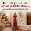 Infographic featuring a green Christmas tree sculpture with a red bow and gold star, highlighting its festive holiday design and seasonal elegance.