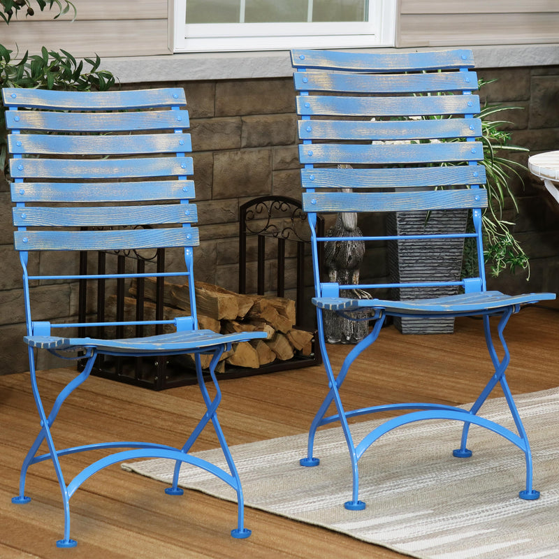 Hand-painted blue folding, slatted chestnut bistro style dining side chairs on the patio.
