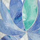 Close-up of the Mosaic Bloom Glass Bird Bath in indigo, showing layered blue, indigo, and aqua glass petals with a textured mosaic finish.