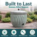 Built to Last, Season After Season: rust-resistant, durable iron construction, weather-ready UV-glazed finish, lid protects contents. Ribbed teal ceramic jar with a domed lid, shown in a garden with hydrangeas