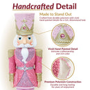 Handcrafted detail infographic featuring a pink, white, and gold Christmas nutcracker with close-up views highlighting vivid hand-painted details and durable polyresin construction.