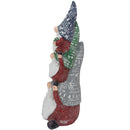 Side view of a stacked Christmas gnome statue showing the patterned blue, green, and gray hats, red clothing, white beards, and black shoes on a white background.