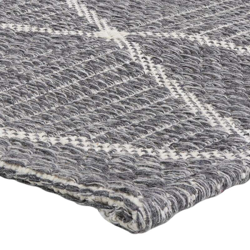 corner of lattice pattern indoor area rug in charcoal