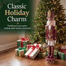 Kristoff Christmas Nutcracker shown beside a decorated Christmas tree and wrapped gifts, featuring traditional nutcracker styling that adds classic holiday charm to a festive indoor space.