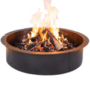 Black circular metal fire pit filled with burning logs, glowing embers, and flames, shown on a white background.