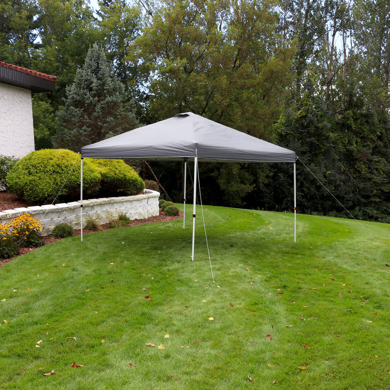 Gray 12'x12' pop up canopy with white frame set up on a backyard lawn.