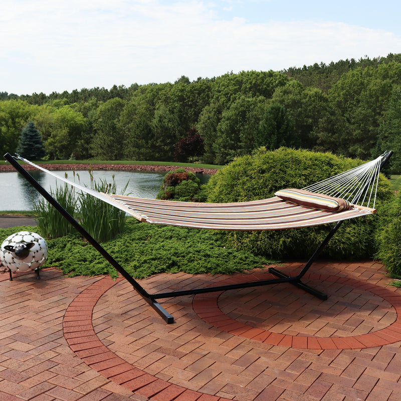 striped quilted hammock with matching pillow with white ropes
