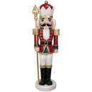 Red and green Christmas nutcracker king holding a gold scepter, wearing a crown, red uniform with gold accents, white pants, black boots, and standing on a round white base against a white background.
