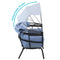 Profile view of blue egg chair showing the stages of the retractable canopy shade.