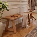 Sunnydaze Teak Trestle Bench in an entranceway in an upperclass traditional style home
