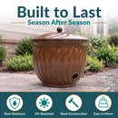 Built to Last, Season After Season: rust-resistant, durable iron construction, weather-ready UV-glazed finish, lid protects contents. Ribbed brown ceramic jar with a domed lid, shown in a garden with hydrangeas