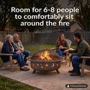 Bronze Cosmic Fire Pit shown with a burning fire in a backyard gathering area, surrounded by four seated adults, highlighting its spacious design with room for 6–8 people to comfortably sit around the fire.