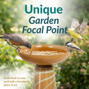 Infographic showing three birds gathered around a tan and cream pedestal bird bath, highlighting it as a unique garden focal point and functional piece of art.