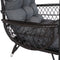 Black wicker armrest of comfort egg chair.