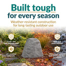Infographic featuring a tall, tapered gray faux rock cover in a landscaped garden transitioning through different seasons. Text highlights weather-resistant construction, including a crack- and fade-resistant shell, UV-resistant polyresin, rain and snow resistance, and durability in extreme heat and freeze-thaw conditions.