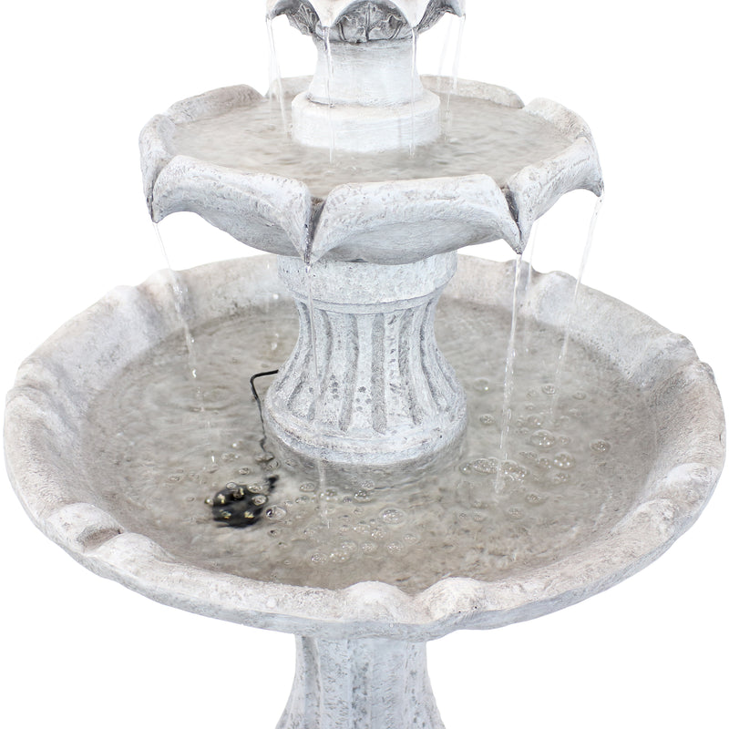 White middle and large bottom fountain tiers being filled with water as it flows through the tiers.