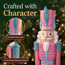 Pink Kristoff Christmas Nutcracker shown in a festive holiday setting, highlighting durable polyresin construction and decorative blue accents on the hat and shoulders.