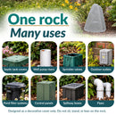 Light gray faux rock utility cover displayed in a landscaped garden, with examples of eight uses: concealing septic tank covers, well pump risers, sprinkler valves, outdoor outlets, pond filter systems, control panels, spillway boxes, and pipes. Text notes the rock is decorative and should not be sat, stood, or leaned on.