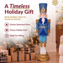Timeless holiday gift infographic featuring a blue, white, and gold Christmas nutcracker displayed beside a decorated Christmas tree and wrapped gifts, with callouts for festive statement piece, classic holiday style, and made for gifting.