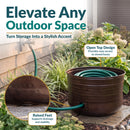 Bronze Hammered Iron Hose Pot shown storing a coiled garden hose, featuring an open-top design for easy access and raised feet that support drainage and stability.