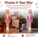 Indoor and covered outdoor display infographic featuring a pink, white, and gold Christmas nutcracker shown in a decorated living room and sheltered entryway, with callouts for indoor and covered outdoor placement.