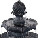 Back view of empty black, two-tiered water fountain. 
