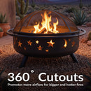 Black Cosmic Fire Pit shown with burning logs in a desert patio setting, highlighting the 360-degree star and moon cutouts that promote airflow for bigger, hotter fires.