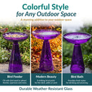 Purple glass birdbath shown in three uses: as a bird feeder, a decorative garden focal point, and a birdbath. Highlights durable, weather-resistant glass.
