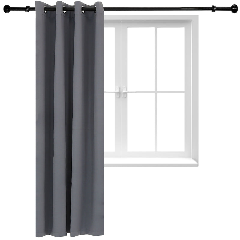 One gray curtain hug from a black curtain rod in front of a white trimmed window.