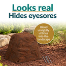 Infographic featuring a low, rounded, tapered dark brown faux rock cover with a realistic stone texture in a mulched garden bed. Text reads “Looks real, Hides eyesores” with a callout explaining how it blends unsightly utilities into the landscape. Three metal ground stakes are displayed beside the rock.