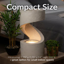 Compact modern indoor fountain measuring approximately 7.75 × 7.75 × 14 inches, featuring a sculptural spiral design with illuminated cascading water, ideal for small indoor spaces.