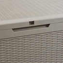 Front handle and locking groove of tan faux rattan deck storage box.