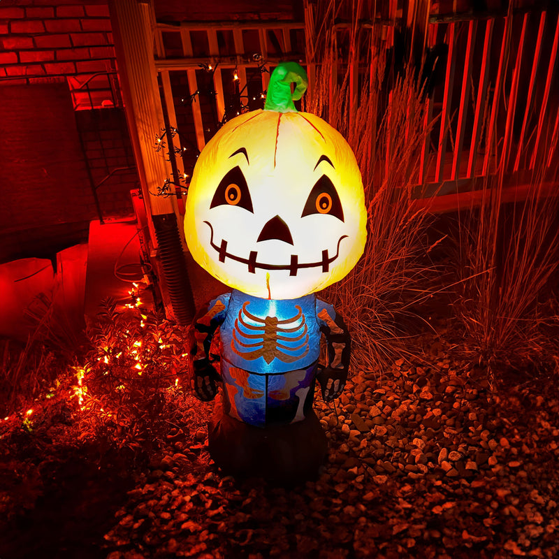 Skelton inflatable with a pumpkin head dimension image showing the height, width and depth with blue arrows.