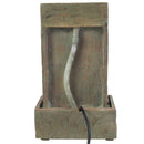 Back view of an outdoor wall fountain showing the textured polyresin housing, water tubing, lower reservoir, and power cord.